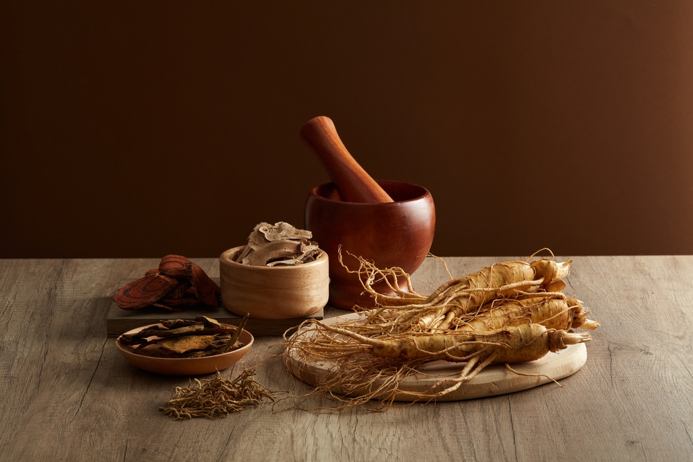 on,the,wooden,table,,ginseng,root,and,medicinal,herbs,displayed